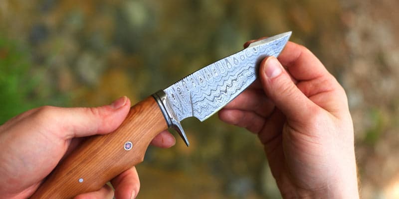 Damascus knife showing its layered steel pattern